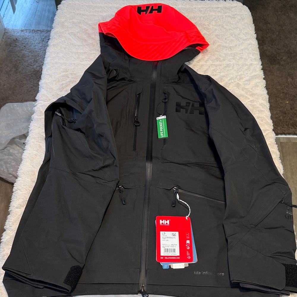 Helly Hansen women’s infinity 3.0 Black Jacket with orange Hood